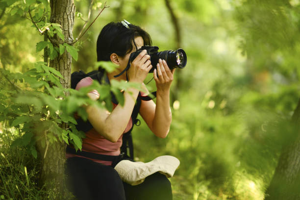 istock young lady walking in the forest 1765559844