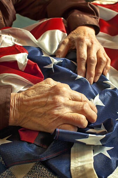 Hands on American flag stock photo