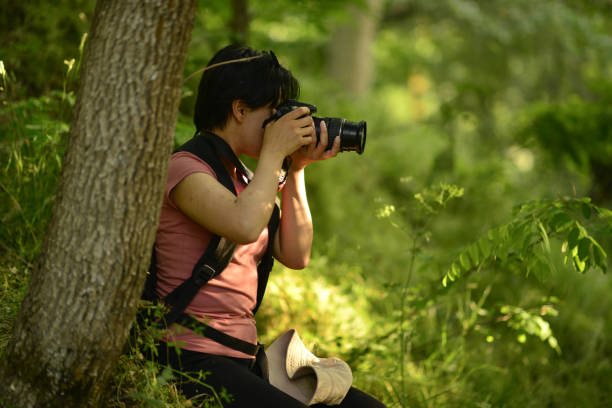 istock young lady walking in the forest 1765560377