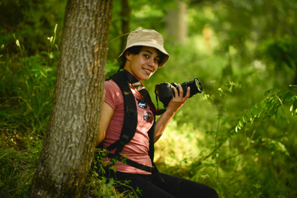 istock young lady walking in the forest 1765560969