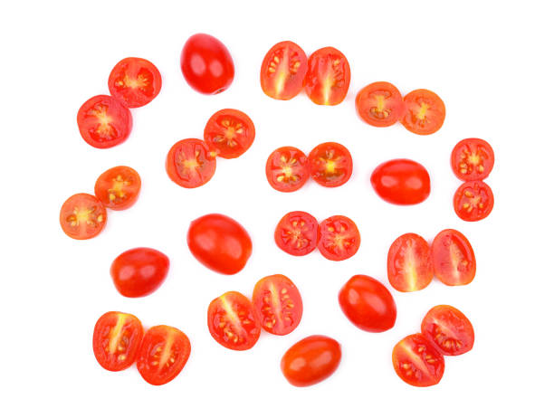 istock Slices of cherry tomato isolated on white 1765564785