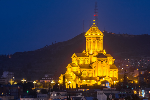 Tbilisi, Georgia - 30 August 2018: Cityscape Skyline In Night Illumination With Famous Landmarks. Rike Park, Holy Trinity Cathedral Or Sameba, Saint George Armenian Cathedral, Metekhi Church.