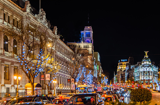 Madrid, Spain - December 20, 2013: Night view of Gran Via in Madrid, Spain, with traffic and Christmas lights