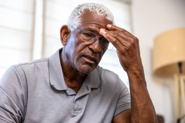 Senior black man with a headache