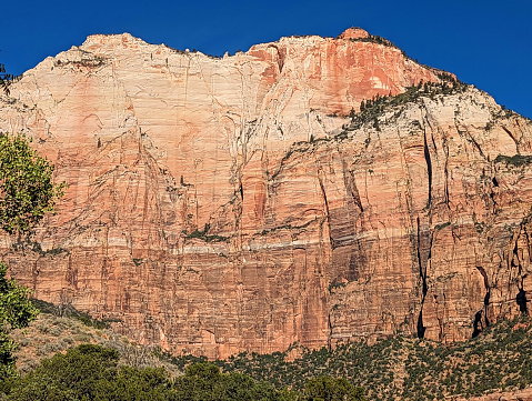 Sandstone cliffs of Zion Canyon at the Community Center and Public Library in Springdale Utah with backdrop of  Zion National Park