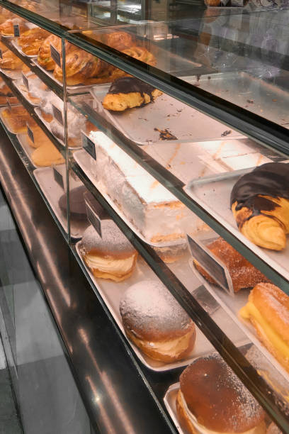 istock Colorful cakes and sweets in a pastry display case. 1765619582