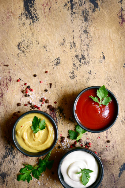 istock Set of popular sauces in a black bowls . Top view with copy space. 1765633874