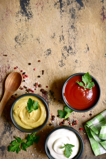 istock Set of popular sauces in a black bowls . Top view with copy space. 1765634416