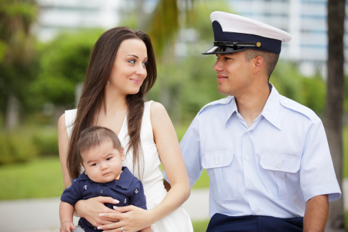 a military man with his family in the park
