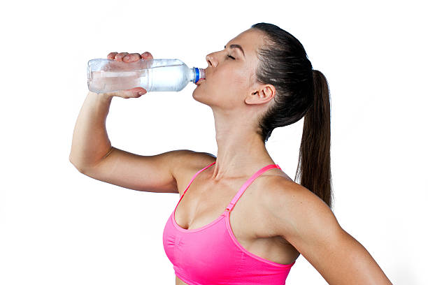 istock fit woman drinking water 176567099