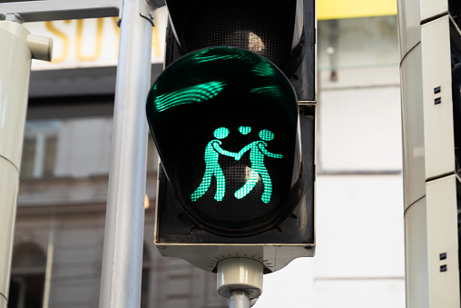 green light on pedestrian crossing in Vienna, Austria representing gay couple