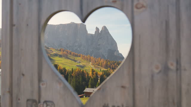 Dolomites visible from heart shaped hole