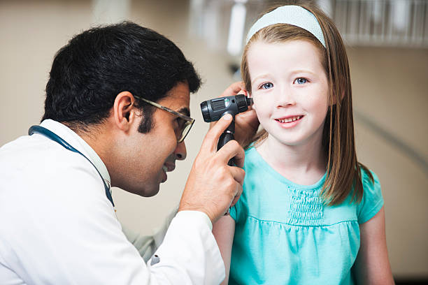 istock Doctor Examining Little Girls Ear 176570547