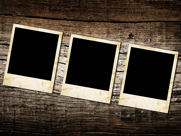 istock Grunge vintage photo frames on a wood 176570589