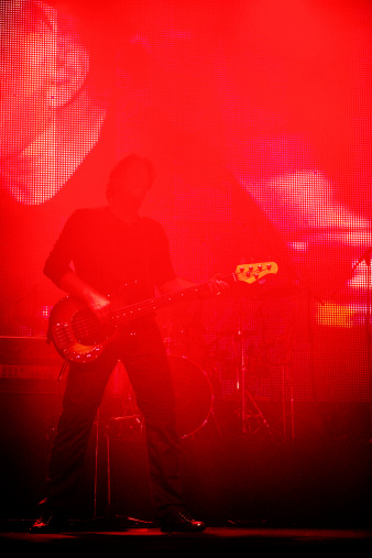 A fisheye image of a heavy metal guitar player.