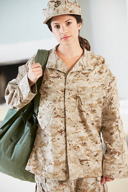 istock Female Soldier With Kit Bag Home For Leave 176571342