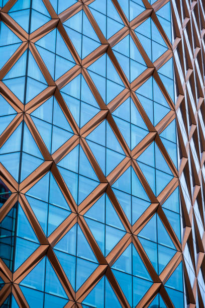 istock Corner facade of a glass and copper high rise building.. 1765719630