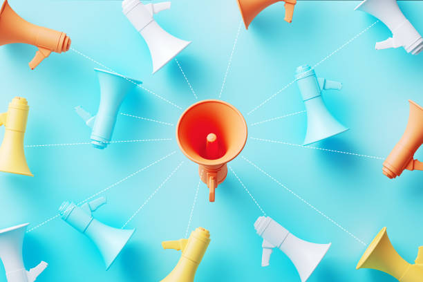 istock Orange Megaphone Surrounded By Colorful Megaphones Which Are Connected By Dotted Lines On Blue Background 1765731256