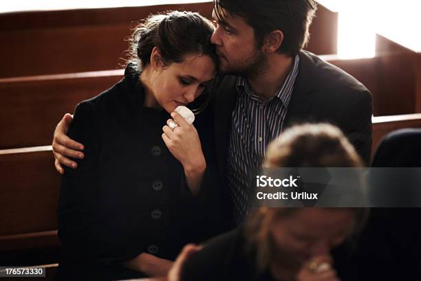 Filled With Sorrow At Their Loss Stock Photo - Download Image Now - Funeral, Sadness, Church