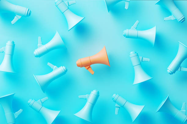 istock Orange Megaphone Surrounded By Blue Megaphones On Blue Background 1765736215
