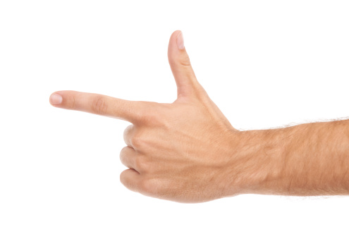 Man pointing with index finger on white background, closeup