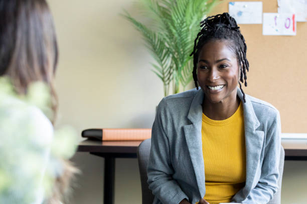 istock A female teacher leads a group discussion with her high school students. 1765738844