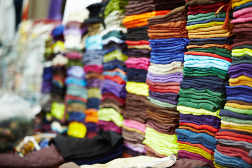 View of colorful indigenous maya fabric with different patterns on market in Chichicastenango, Guatemala