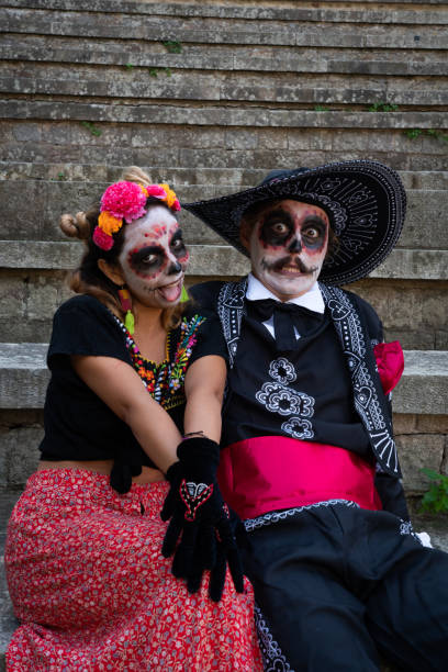 istock Couple of young people dressed as catrines making funny faces 1765746445