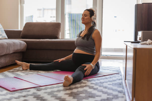 istock Pregnant woman doing stretching exercises 1765757840