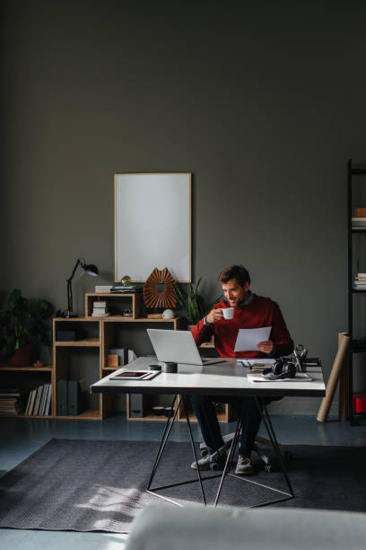istock A Happy Handsome Businessman Enjoying Drinking His First Morning Coffee While Working In His Office 1765761853