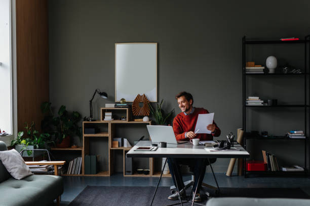 istock A Happy Handsome Businessman Reading Something On His Computer While Sitting In His Office And Working 1765762394