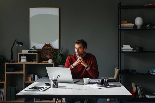 A Focused Handsome Businessman Working On His Computer In The Office
