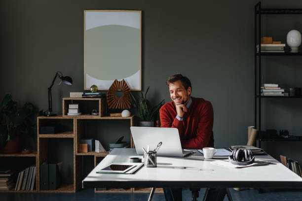 istock A Happy Handsome Businessman Working On His Computer In The Office 1765762409
