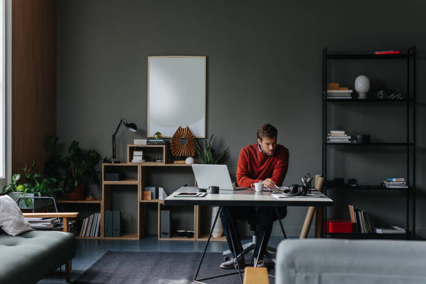 istock A Serious Handsome Businessman Working While Sitting In The Office In Front Of  The Computer 1765762411