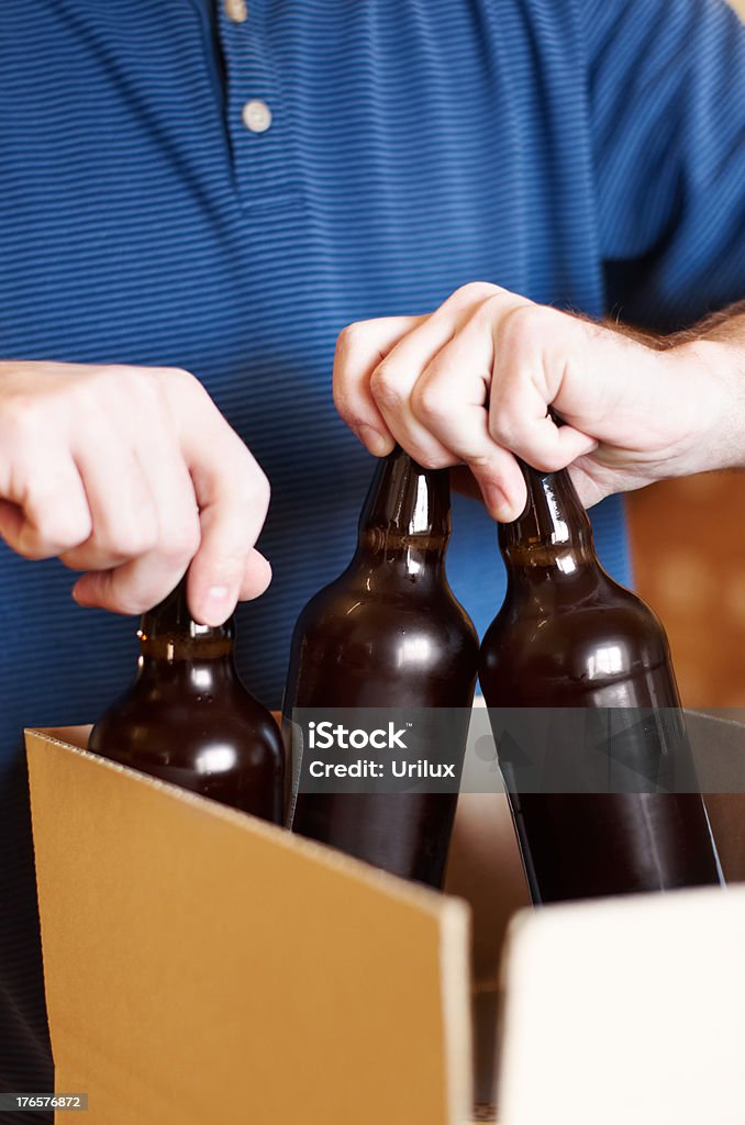 Carefully packing each one  Beer - Alcohol Stock Photo