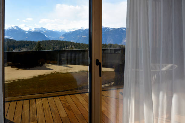 istock Winter mountains in snow through a closed hotel window 1765801491