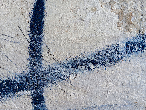 Black paint grunge wall texture. Old rough stained cement wall.