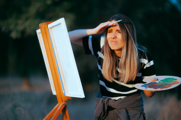 istock Woman Squinting Not seeing Afar trying to Paint 1765822752