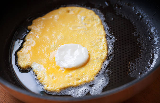 istock Original roasted eggs with white center in black pan 176583863