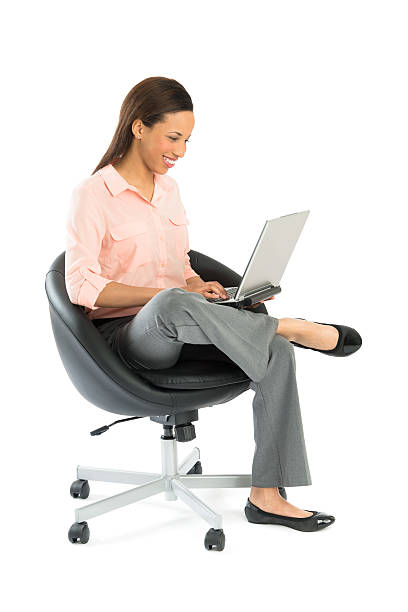 istock Businesswoman Using Laptop While Sitting On Office Chair 176584380