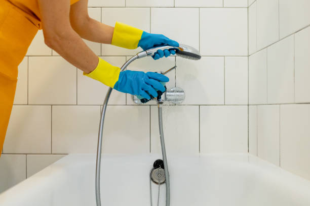 istock Woman cleaning the bathroom 1765867687