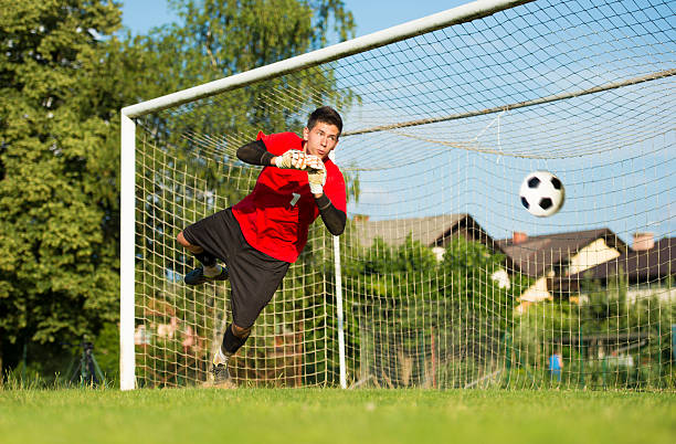 istock Soccer goalie defending in mid-air 176587159