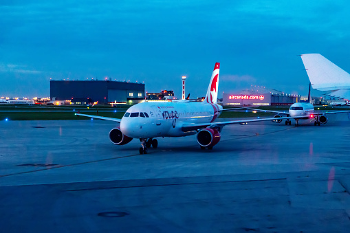 An Air Canada airplane taxiing on the runway of Toronto Pearson International Airport, Canada.