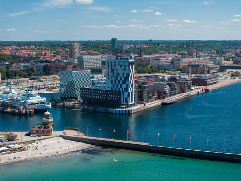 View of the Helsinborg city centre and the port of Helsingborg in Sweden. Old town by the beach and city port in Helsingborg harbour. Beautiful aerial view.