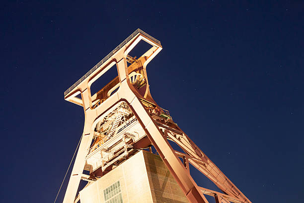 istock illuminated shaft tower of coal mine at night 176589257