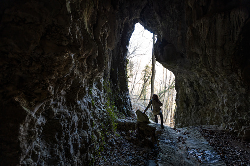 Woman Tourist Discovering Entrance in a Karst Cave - Babja cave Most na Soci - Slovneia
