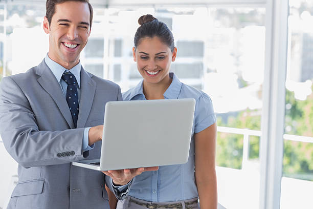 istock Businessman partners looking at laptop and laughing 176592703