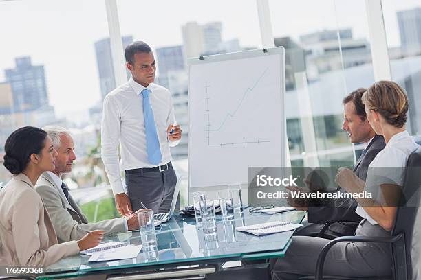 Manager Standing In Front Of Colleagues Stock Photo - Download Image Now - Sales Pitch, Board Room, Business