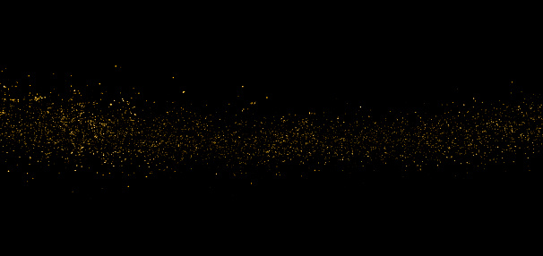 Glittering stardust trail on black background