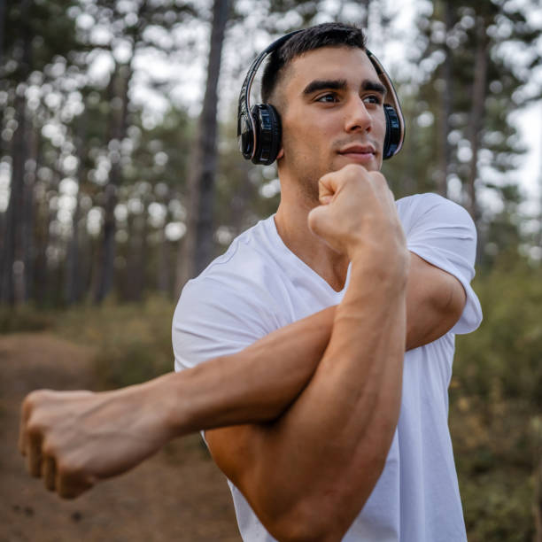 istock one man male athlete stretch in nature 1765943447
